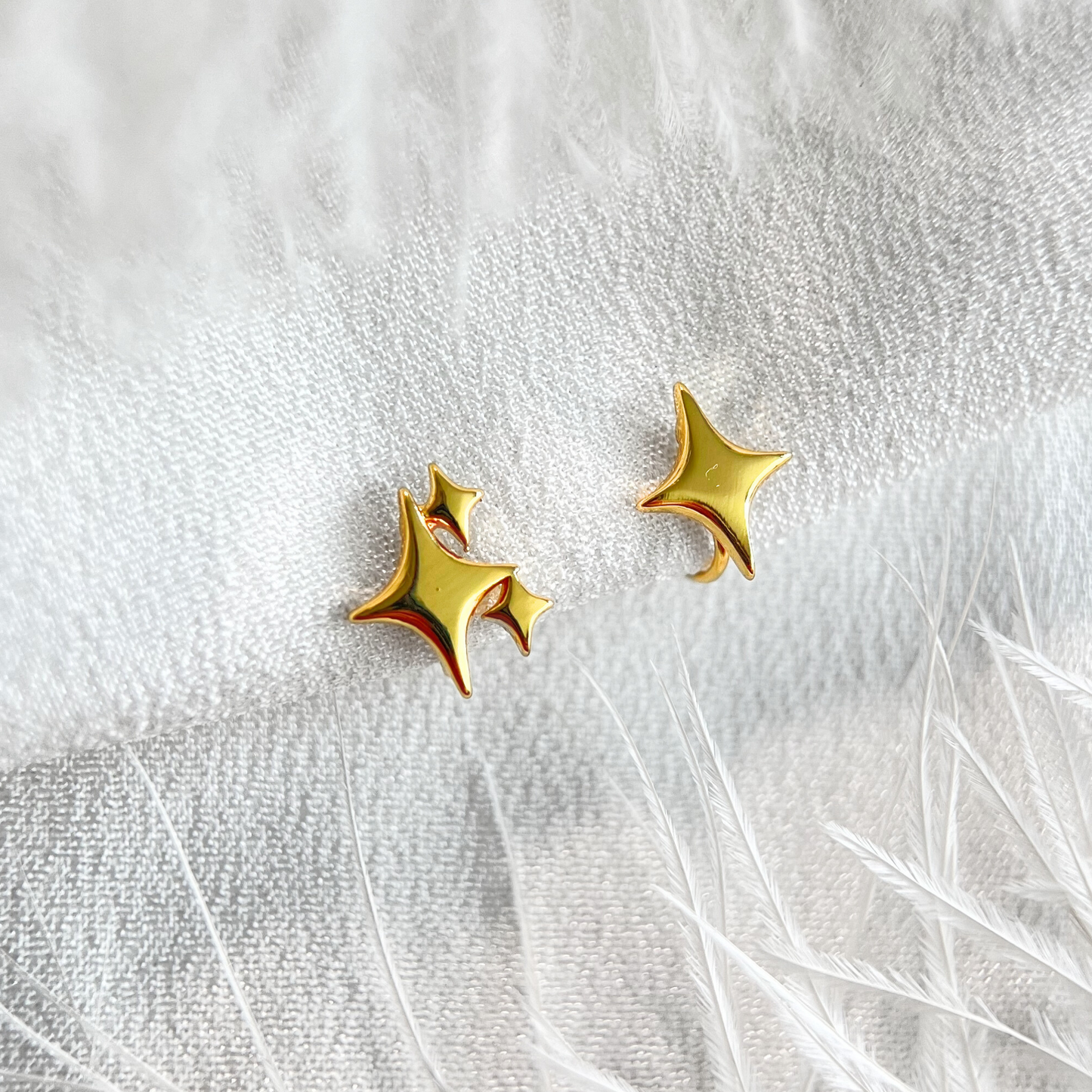 Gold Mismatched Star Clip On Earrings